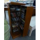 A POLISHED WOOD CD STORAGE CABINET AND A SELECTION OF DVD?s