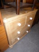 VICTORIAN PINE CHEST OF TWO SHORT AND TWO LONG DRAWERS, WITH WHITE POT HANDLES, QUADRANT