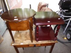 A MAHOGANY CIRCULAR LOW SEWING TABLE WITH WAVY EDGE AND A MAHOGANY FINISH SQUARE TWO TIER LAMP TABLE