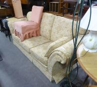 A THREE SEATER SETTEE AND WINGED LOUNGE CHAIR ENSUITE, COVERED IN GOLD EMBROIDERED FAWN FABRIC