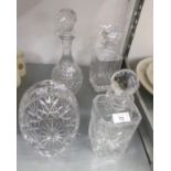 TWO SQUARE CUT GLASS CRYSTAL DECANTERS, A CUT GLASS WINE DECANTER AND A BASKET PATTERN FRUIT BOWL (