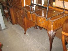 A QUEEN ANNE STYLE WALNUTWOOD SIDE TABLE WITH SERPENTINE FRONT, HAVING TWO DRAWERS, RAISED ON LONG