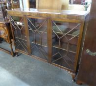 A MAHOGANY DWARF BOOKCASE ENCLOSED BY THREE ASTRAGAL GLAZED DOORS, 4?6? WIDE