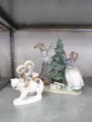 MODERN LLADRO PORCELAIN MODEL OF A BOY AND GIRL dressing a Christmas Tree, 13" (33cm) high, AND