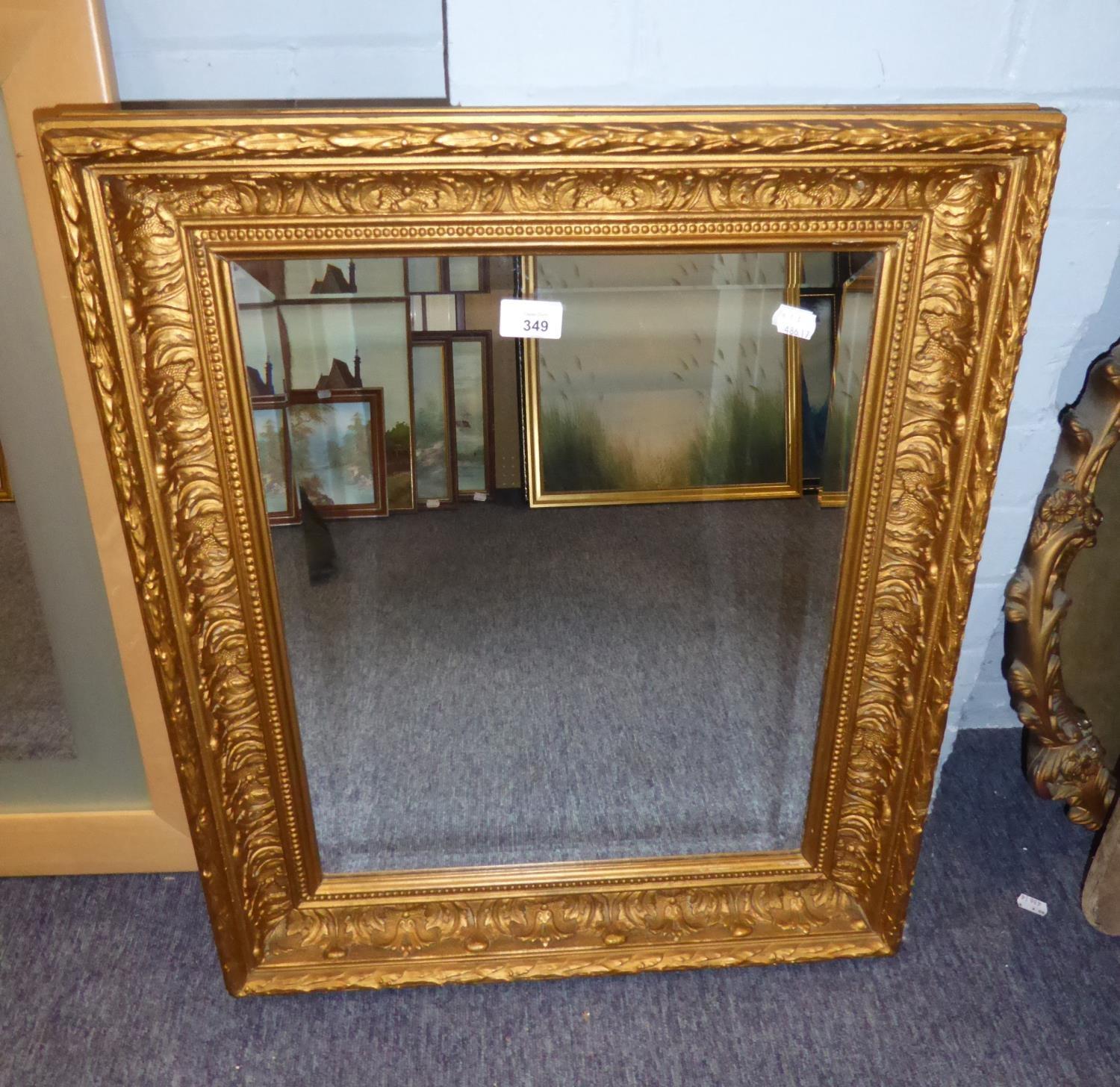 A RECTANGULAR BEVELLED EDGE WALL MIRROR, IN GILT FRAME, 26? X 22?