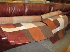 A BELGIUM MODERN POLYPROPYLENE LARGE RUG,  WITH A RECTANGULAR PATTERN IN BROWN AND FAWN, 5?9? X 4?