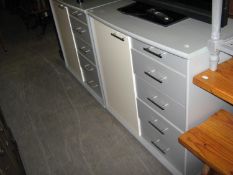 A PAIR OF TWO-TONE GREY FINISH BEDROOM CABINETS WITH SINGLE DOOR CUPBOARDS NEXT TO A NEST OF FIVE