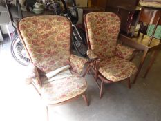 A PAIR OF BEECH WOOD COTTAGE STYLE WINGED COMB BACKED FIRESIDE ARMCHAIRS, COVERED IN FAWN AND FLORAL