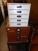 A GREY METAL TABLE TOP NEST OF FIVE FILING DRAWERS AND A TABLE TOP NEST OF SIX FILING DRAWERS (2)