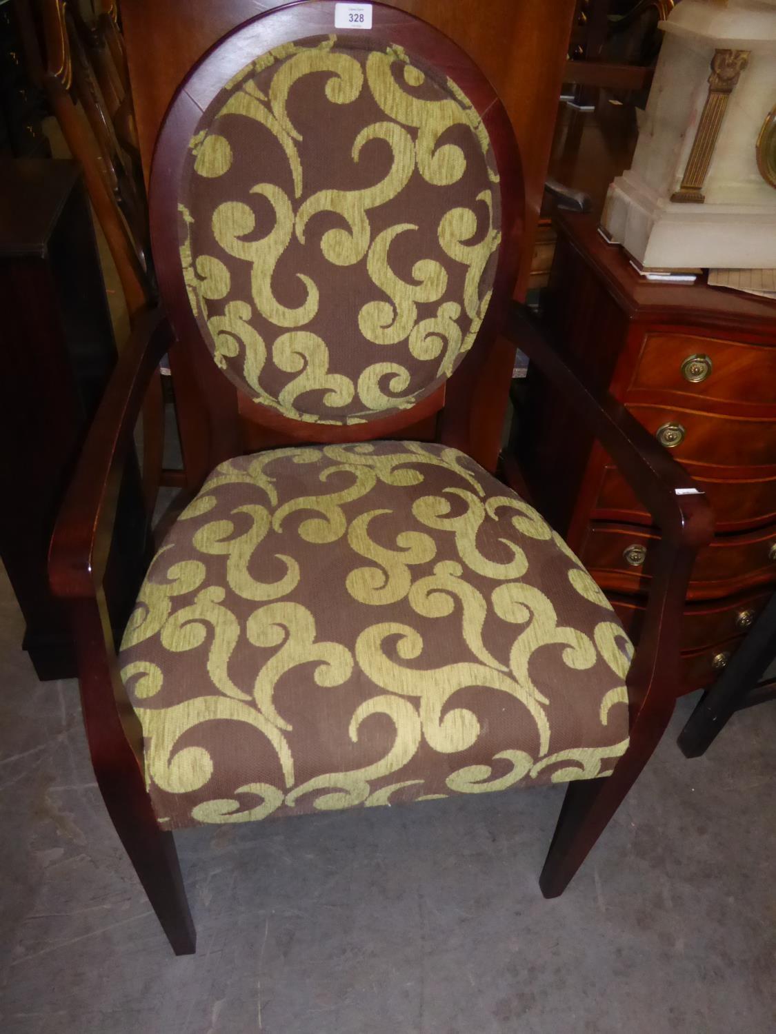 STUART JONES OPEN ARMCHAIR, THE CIRCULAR SHOW WOOD BACK AND THE STUFFED OVER SEAT, COVERED IN MAROON