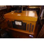 A LIGHT OAK CASED VINTAGE STYLE TABLE TOP RADIO, RECORD TURNTABLE AND CASSETTE TAPE PLAYER