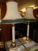 A PAIR OF CREAM AND GILT WOOD CLASSICAL COLUMN BEDSIDE LAMPS AND THE DOUBLE SILK CREAM AND GREEN