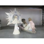 MODERN LLADRO PORCELAIN MODEL OF A YOUNG MOTHER reclining cradling a new born child with an older