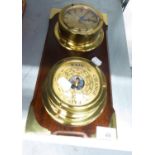 A SHIPS STYLE BRASS CLOCK AND BAROMETER, ON MAHOGANY PANEL WITH BRASS CORNERS