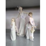 THREE LLADRO PORCELAIN FEMALE FIGURES; ELEGANT LADY WITH ELABORATE HEADDRESS, POSING IN A FULL