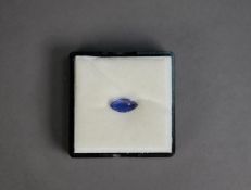 Black plastic sealed vision box containing a MARQUISE SHAPED BLUE GEM STONE