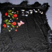 CONTINENTAL BLACK SILK SHAWL, embroidered in one diagonal half with poppies, a large butterfly and