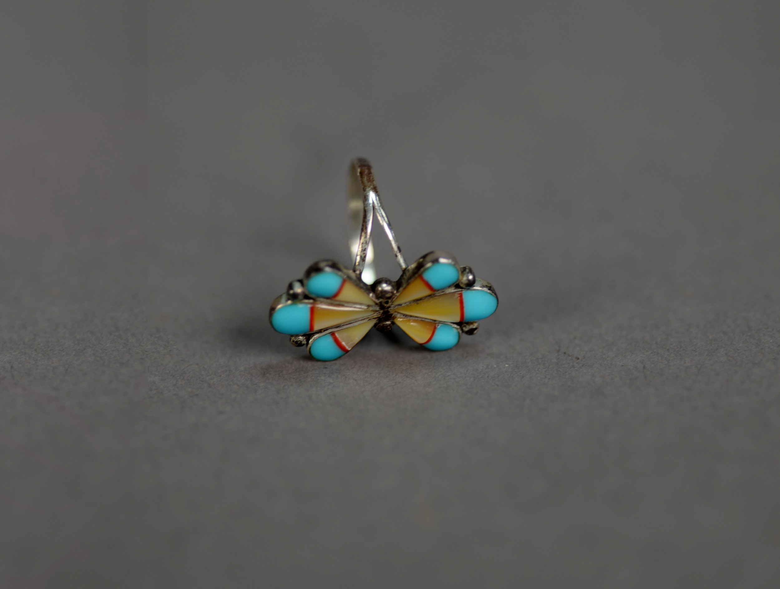 STERLING SILVER BUTTERFLY RING, the wings each of three sections, yellow enamelled with turquoise