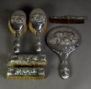 EDWARD VII EMBOSSED SILVER BACKED SIX PIECE DRESSING TABLE HAND MIRROR AND BRUSH SET IN ORIGINAL