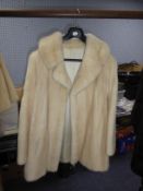 CREAM PASTEL MINK THREE-QUARTER LENGTH COAT with revered collar, double breasted hook fastning