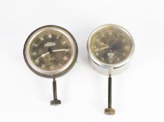 TWO PRE-WAR DASHBOARD MOUNTED CAR CLOCKS, both with black dials and white numbers and hands, one