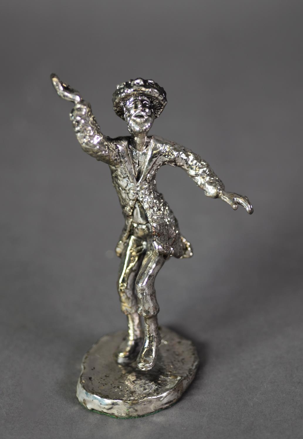 ISRAELI SILVER COLOURED METAL CASED FIGURE of a man in dancing pose, on oval base, 5 ½? (13.9cm) - Image 2 of 2