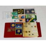SMALL BOOTS RING BINDER COIN ALBUM CONTAINING WORLD COINAGE SETS, mainly 1980s onwards to include