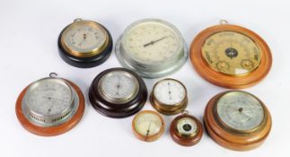 NINE EARLY TWENTIETH CENTURY AND LATER WALL MOUNTED ANEROID BAROMETERS, in circular cases, 3 ½?-