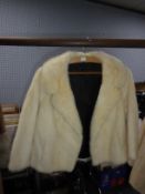 CREAM PASTEL MINK SHORT EVENING JACKET with revered collar, single hook fastening double breasted