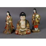 TWO PRE-WAR JAPANESE SATSUMA FIGURE OF WOMEN, in multi-coloured costume, one holding a large