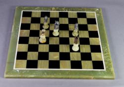 POST-WAR ITALIAN 'ARAGONITE' GREEN ONYX and GILT METAL CHESS SET on heavy green and black onyx