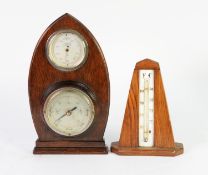 EARLY TWENTIETH CENTURY WALL MOUNTED ANEROID BAROMETER AND THERMOMETER, mounted on a shaped and