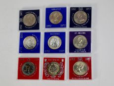 EIGHT SILVER JUBILEE 1977 CROWN COINS from various Commonwealth countries, each in a plastic