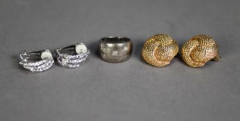 BROAD SILVER BAND RING, the top gypsy set with three square cut white paste stones; a pair of Ciro