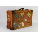 PRE-WAR WELL USED LEATHER SUITCASE, applied with NINE CONTEMPORARY COLOUR PRINTED EUROPEAN TRAVEL