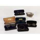 TWO PAIRS OF EARLY 20th CENTURY GILT WIRE FRAMED SPECTACLES (one pair lacks lenses); TWO OTHER PAIRS