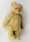 PRE-WAR BLOND PLUSH TEDDY BEAR of English manufacture, shaved broad snout with stitched detail,