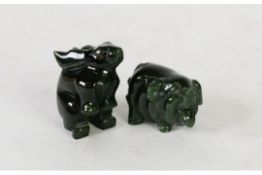 BURMESE CARVED DARK GREEN JADE MODEL OF A PIG, 2in (5cm) long and ANOTHER OF A RABBIT, on its hind