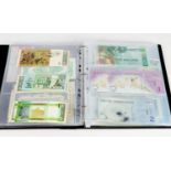 RING BINDER CONTAINING A GOOD SELECTION OF WORLD BANK NOTES, late 20th Century to early 21st