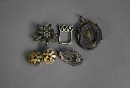 SILVER PENDANT with quartz back; a silver thistle BROOCH; a silver and marcasite flower BROOCH; a