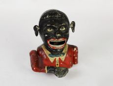EARLY 20th CENTURY JOLLY CAST ALLOY MONEY BANK, the base grill marked Starkies Patent, approximately