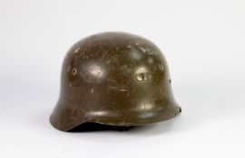 GERMAN WORLD WAR II STEEL HELMET, with original green painted finish, interior leather fittings (