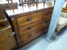 VICTORIAN FIGURED MAHOGANY CHEST OF THREE LONG DRAWERS WITH TURNED WOOD KNOB HANDLES, ON PLINTH