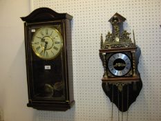 A MAHOGANY CASED DROP DIAL WALL CLOCK, (MODERN), BATTERY OPERATED AND A DUTCH STYLE WALL CLOCK (2)