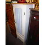 A BEECH AND WHITE FINISH TALL, NARROW FLOOR STANDING BATHROOM CABINET, WITH CURTAIN PANEL TO THE