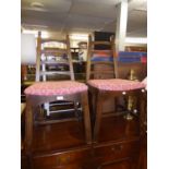 A PAIR OF STYLISH HEAVY OAK LADDER BACK SINGLE CHAIRS, THE SEATS COVERED IN WINE RED PATTERNED