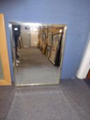 A RECTANGULAR BEVELLED EDGE WALL MIRROR, IN BRIGHT STEEL FRAME