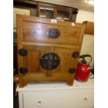CHINESE HARDWOOD BEDSIDE CUPBOARD WITH TWO DOORS AND A DRAWER ABOVE, WITH HEAVY METAL FITTINGS AND
