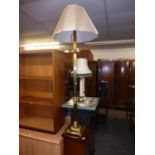 A GILT BRASS STANDARD LAMP AND PINK SILK SHADE