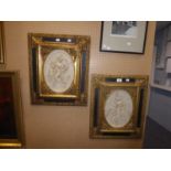 PAIR OF TWENTIETH CENTURY MOULDED COMPOSITION OVAL PLAQUES, DEPICTING CLASSICAL MAIDENS AND CHERUBS,